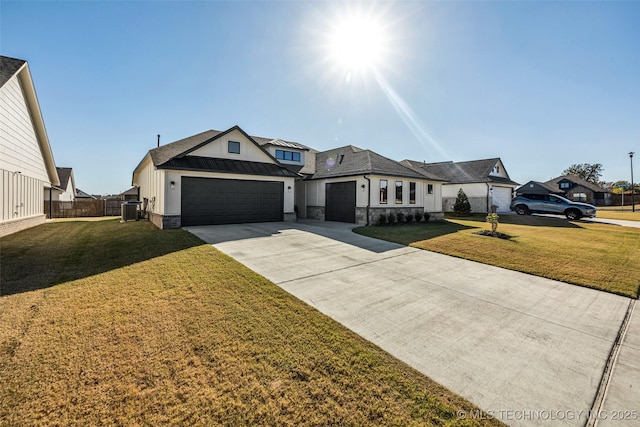 view of front of property featuring metal roof, a front lawn, a standing seam roof, and an attached garage