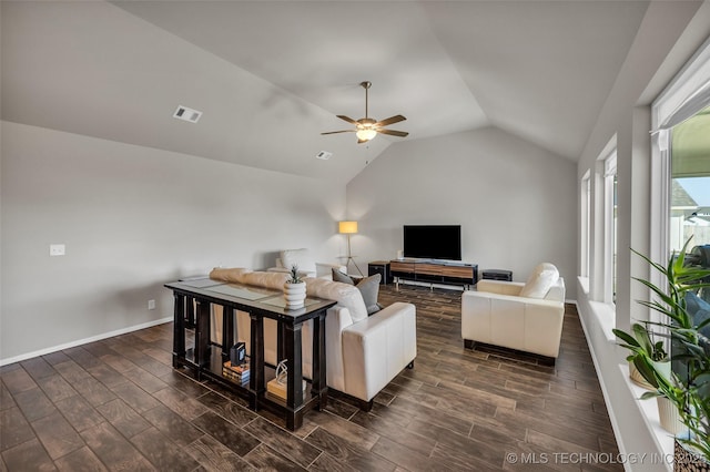 living room with wood finish floors, visible vents, baseboards, vaulted ceiling, and a ceiling fan