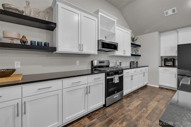 kitchen with white cabinetry, visible vents, appliances with stainless steel finishes, and open shelves