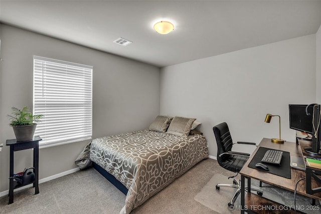 bedroom featuring carpet floors, visible vents, and baseboards