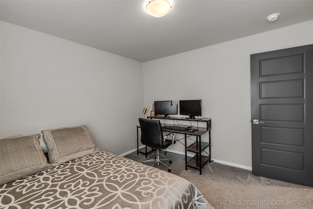 carpeted bedroom featuring baseboards