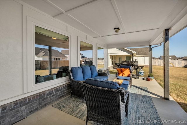 view of patio with outdoor lounge area and fence