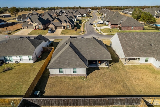 birds eye view of property with a residential view