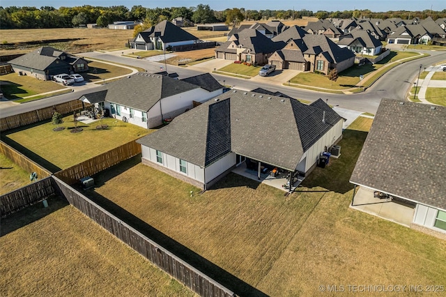 birds eye view of property with a residential view