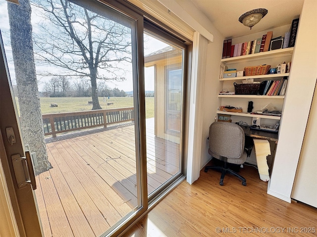 doorway to outside featuring wood finished floors