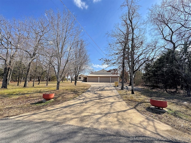 view of front of property featuring driveway and an attached garage