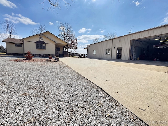 exterior space with an outbuilding and driveway