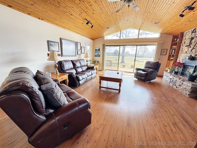 living area with vaulted ceiling, ceiling fan, wood finished floors, and wood ceiling