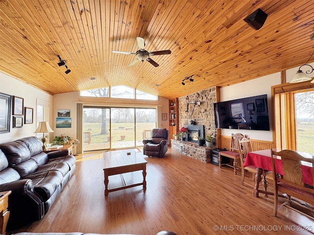 living room with lofted ceiling, wooden ceiling, wood finished floors, and a ceiling fan