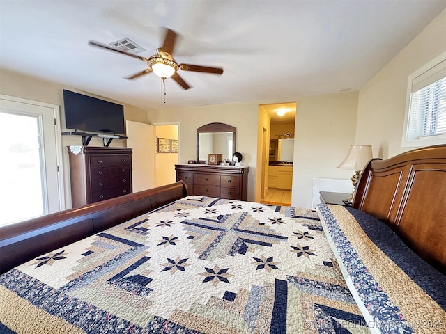 bedroom with ceiling fan, connected bathroom, and visible vents