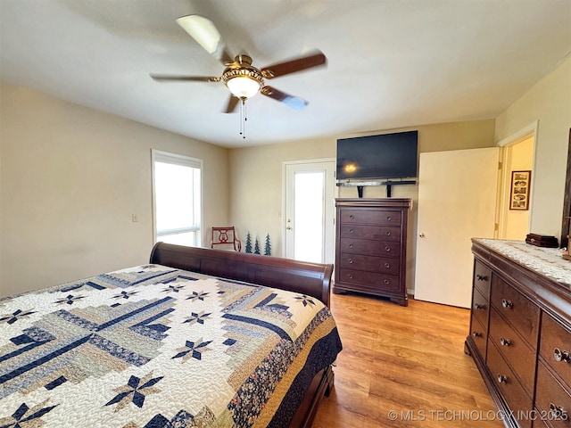 bedroom with light wood-style flooring and ceiling fan