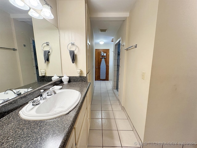 bathroom featuring visible vents, vanity, and tile patterned floors