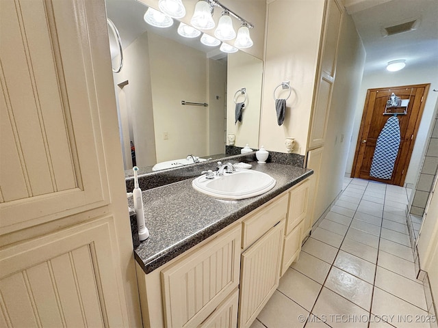 bathroom featuring visible vents, tile patterned flooring, and vanity