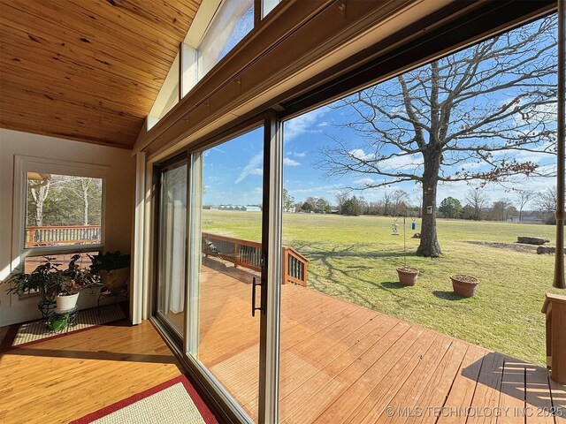 interior space featuring wooden ceiling, vaulted ceiling, and wood finished floors