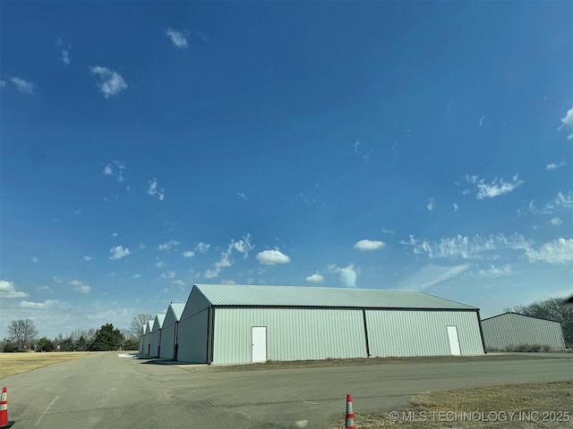 view of property featuring an outbuilding