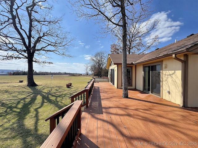 wooden deck featuring a yard