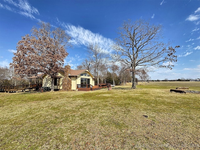 view of yard with a deck