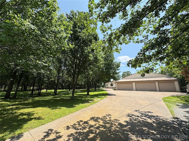 32432 S Skyline Dr, Cookson, OK 74427 - view of front of property with a garage, a front yard, and an outbuilding