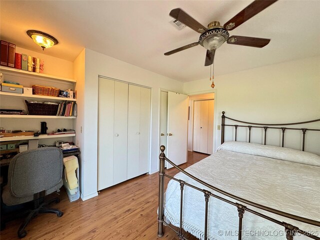 32432 S Skyline Dr, Cookson, OK 74427 - bedroom with wood finished floors, two closets, an office area, and ceiling fan