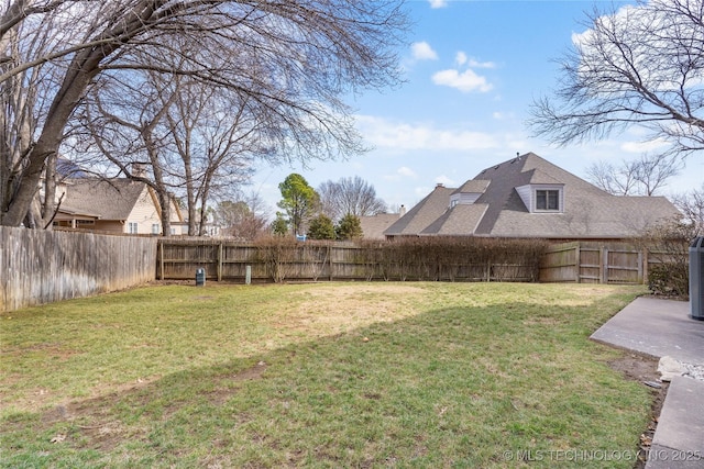 view of yard with a fenced backyard