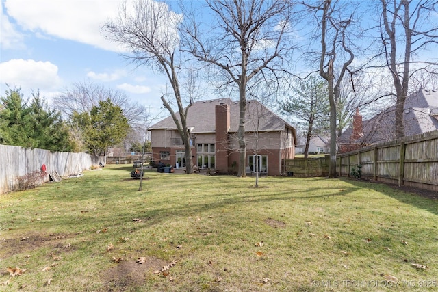 view of yard with a fenced backyard