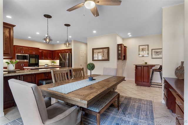 dining room featuring light tile patterned floors, a ceiling fan, and recessed lighting