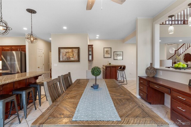 dining space featuring light tile patterned flooring, recessed lighting, a ceiling fan, stairway, and built in desk