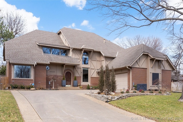 view of front of property with an attached garage, brick siding, driveway, roof with shingles, and a front yard