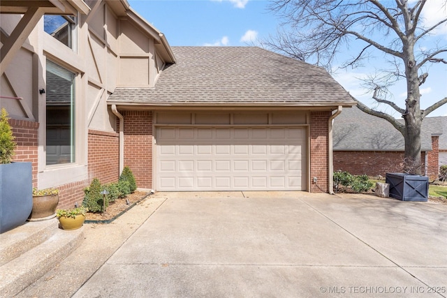 garage with concrete driveway