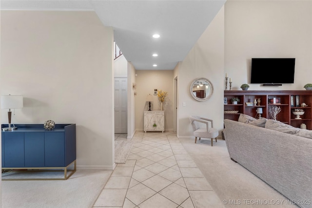 living area featuring recessed lighting, light tile patterned flooring, light carpet, and baseboards