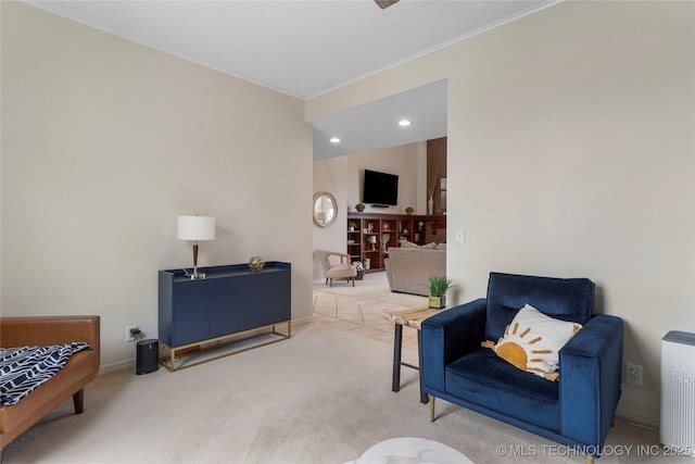 sitting room featuring recessed lighting, carpet flooring, crown molding, and baseboards