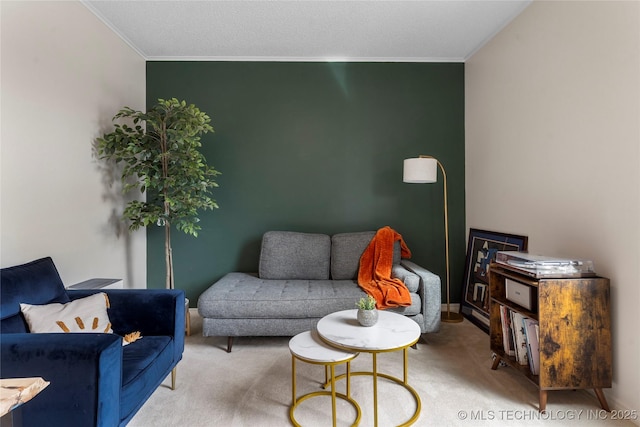 living room featuring carpet, crown molding, and baseboards