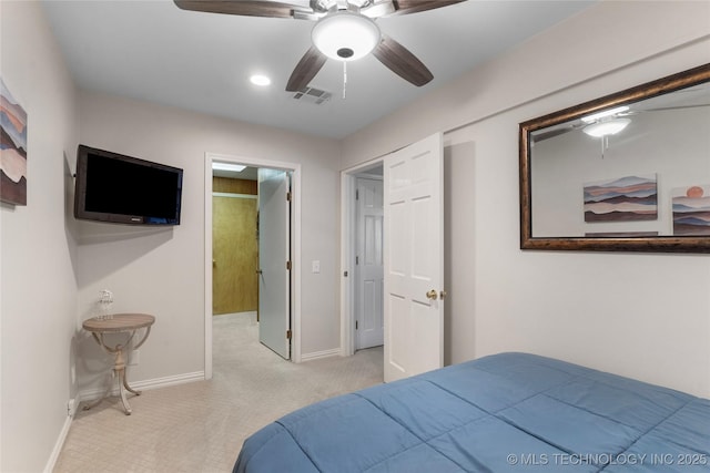 carpeted bedroom with a ceiling fan, visible vents, and baseboards