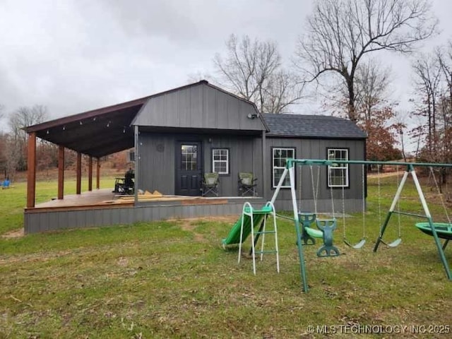 view of playground with a lawn