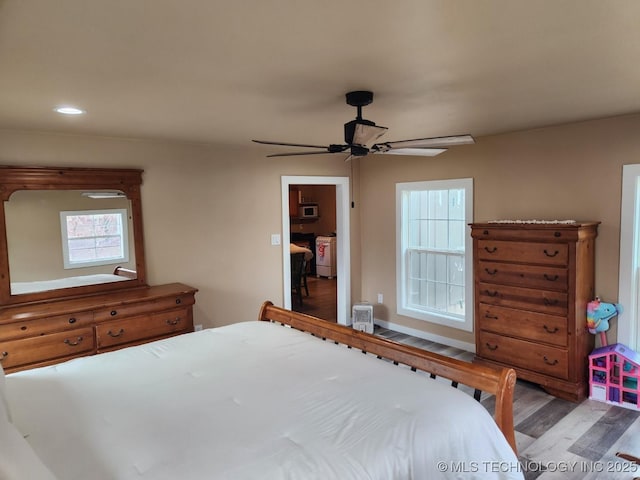 bedroom featuring ceiling fan, wood finished floors, and recessed lighting