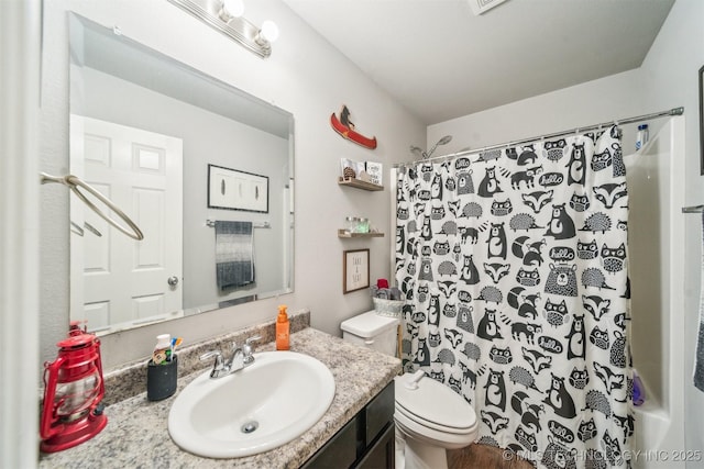 full bathroom featuring toilet and vanity