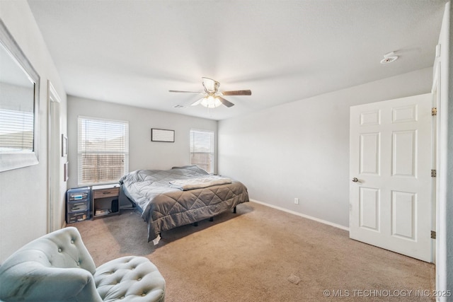 bedroom with carpet flooring, a ceiling fan, and baseboards