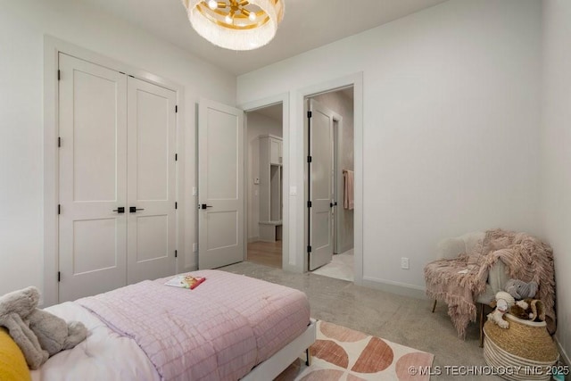 12030 S Vandalia Ave, Tulsa, OK 74137 - bedroom with a chandelier, a closet, and light carpet