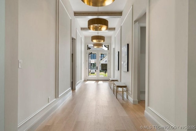12030 S Vandalia Ave, Tulsa, OK 74137 - hall with light wood-style flooring and beam ceiling
