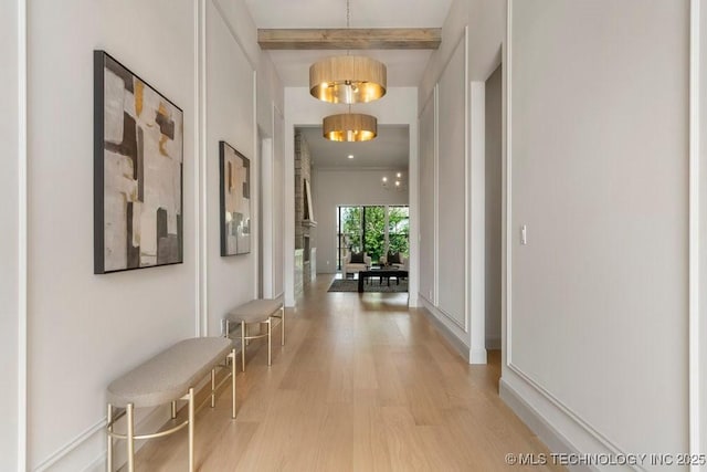 12030 S Vandalia Ave, Tulsa, OK 74137 - hallway featuring wood finished floors and beam ceiling