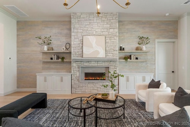 12030 S Vandalia Ave, Tulsa, OK 74137 - living room with ornamental molding, a fireplace, and light wood-style flooring