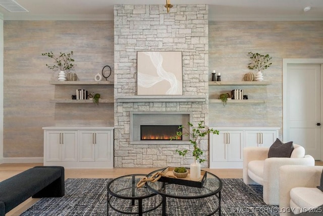 12030 S Vandalia Ave, Tulsa, OK 74137 - living area featuring crown molding, a stone fireplace, and wood finished floors