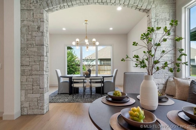 12030 S Vandalia Ave, Tulsa, OK 74137 - dining area with wood finished floors and a chandelier