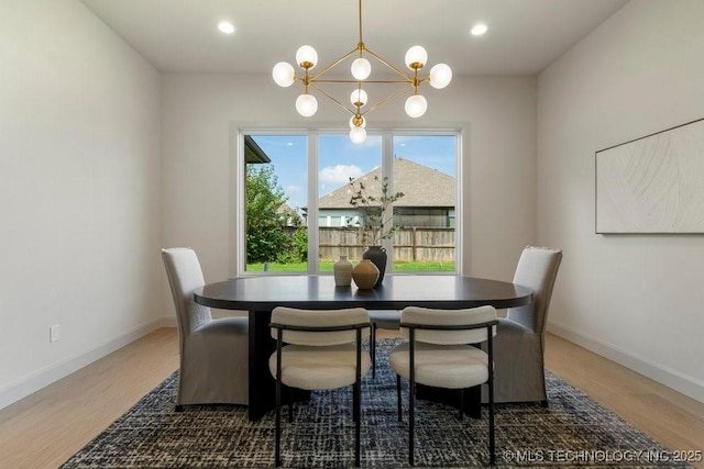 12030 S Vandalia Ave, Tulsa, OK 74137 - dining area with a chandelier, wood finished floors, and recessed lighting