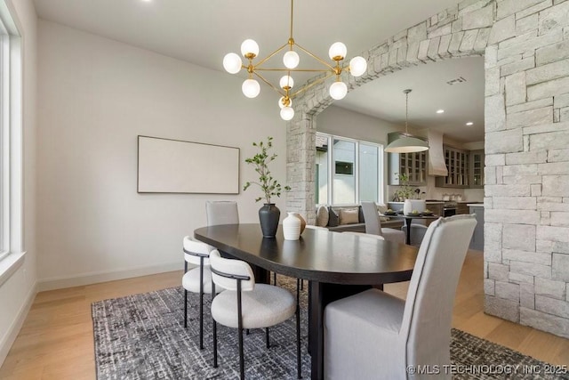 12030 S Vandalia Ave, Tulsa, OK 74137 - dining room with light wood-style floors, decorative columns, recessed lighting, and a chandelier