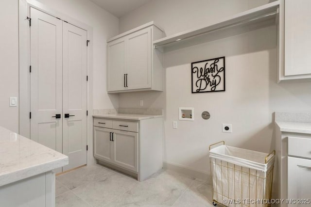 12030 S Vandalia Ave, Tulsa, OK 74137 - laundry area with hookup for an electric dryer, cabinet space, hookup for a washing machine, and light tile patterned floors
