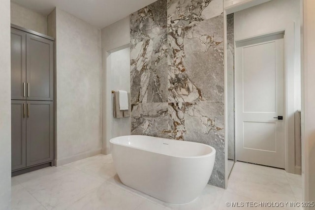 12030 S Vandalia Ave, Tulsa, OK 74137 - full bathroom with a freestanding tub, marble finish floors, and tile walls