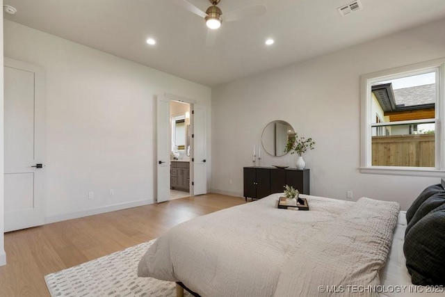 12030 S Vandalia Ave, Tulsa, OK 74137 - bedroom featuring light wood-style floors, recessed lighting, ensuite bath, and a ceiling fan