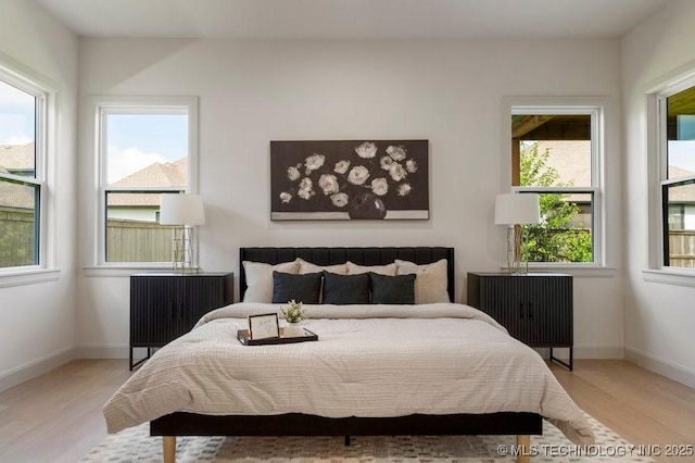 12030 S Vandalia Ave, Tulsa, OK 74137 - bedroom featuring wood finished floors and baseboards