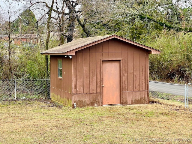 view of shed with fence